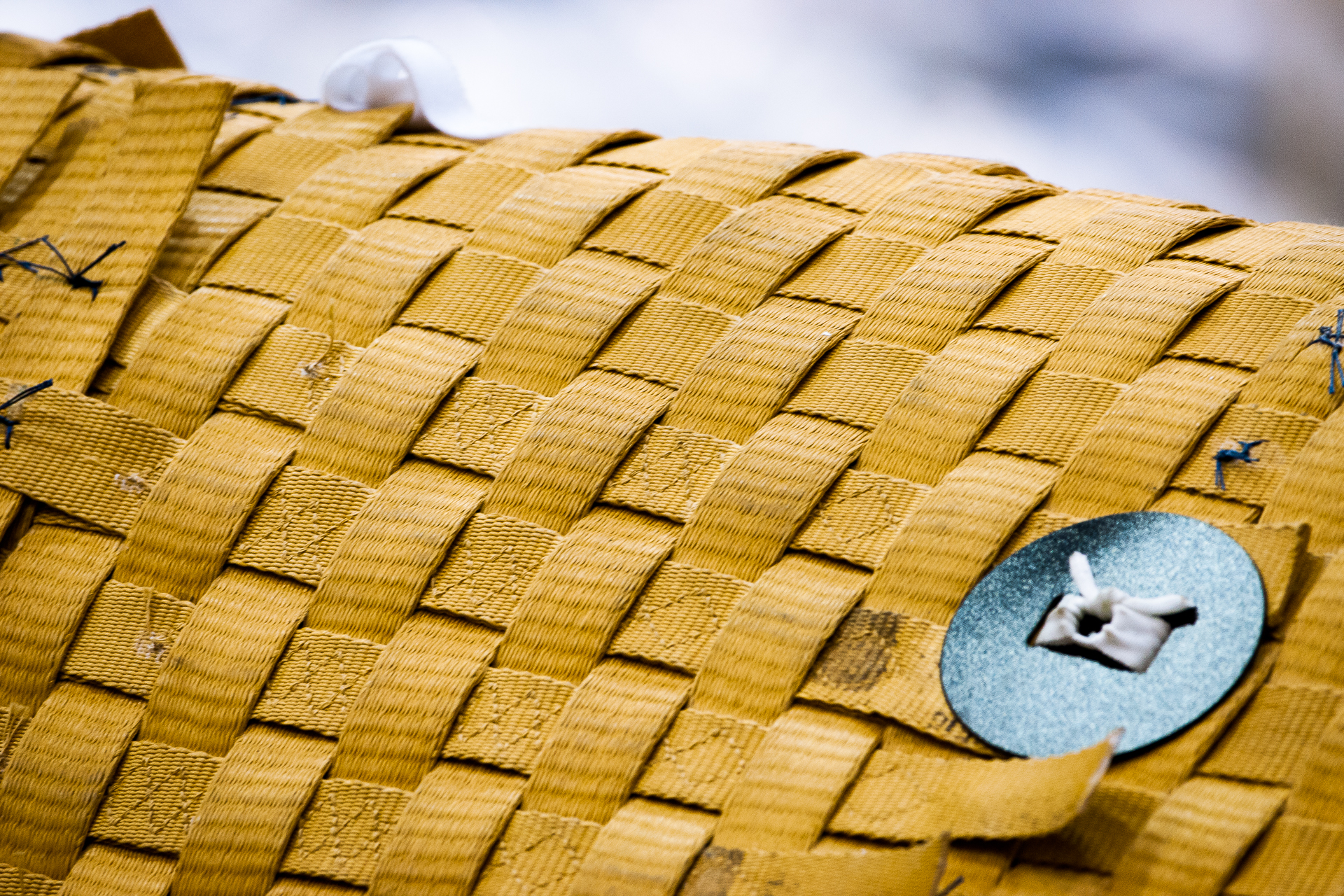 Real photograph of interlaced broad strips and local stitching. Source describes Kevlar detail from a proposed inflatable space habitat. Visible structure only, not a magnified ordinary bag fabric weave or proof of grade, authenticity, performance or JKPD adoption. Unmodified.